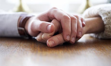Hands holding.