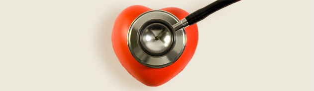 A stethoscope on a red heart