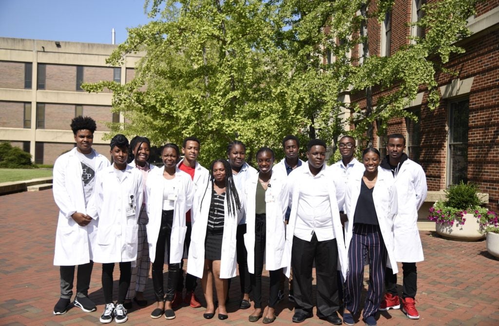 A student group outside the Med-Dent Building