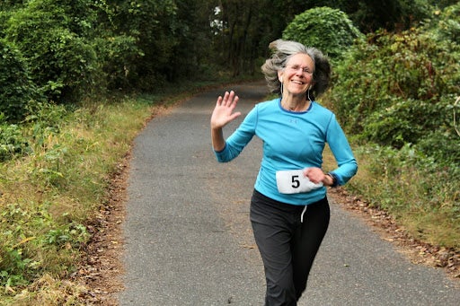 A single runner waves