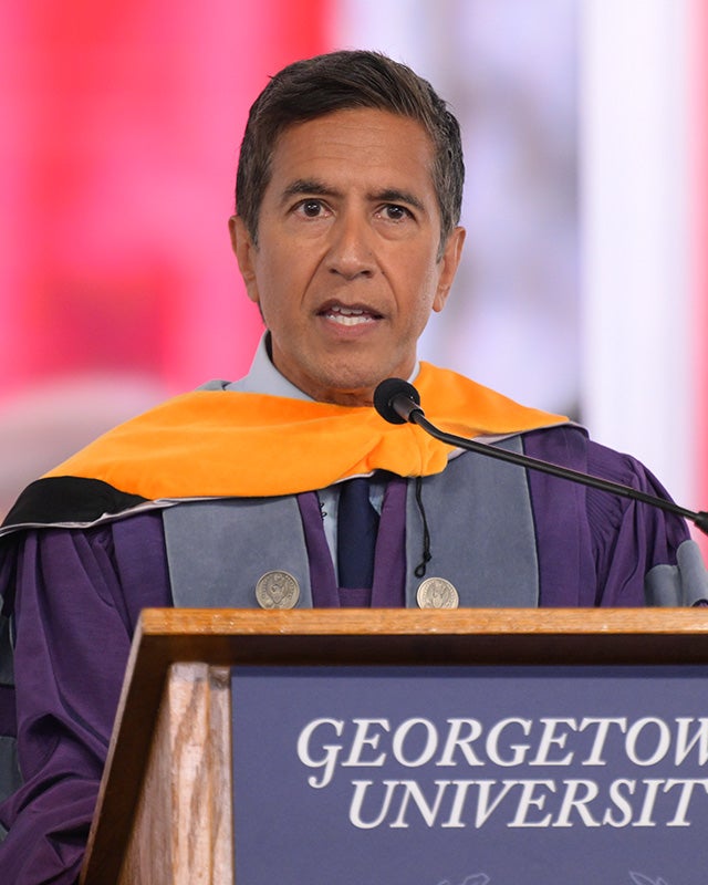 Sanjay Gupta speaks from a podium