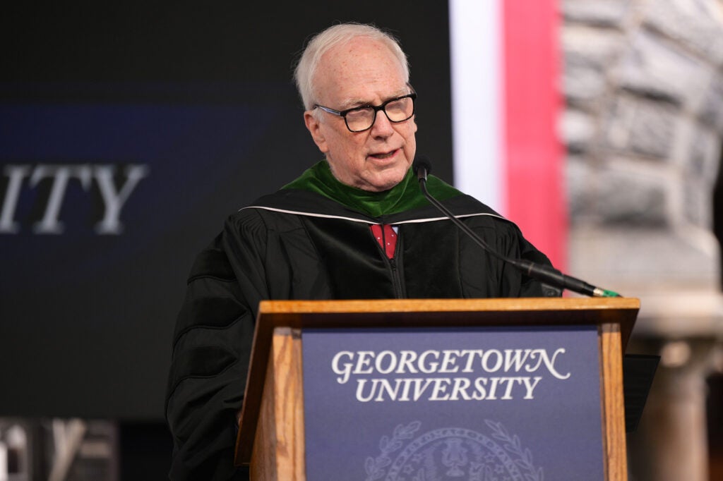 Edward Healton speaks from a podium
