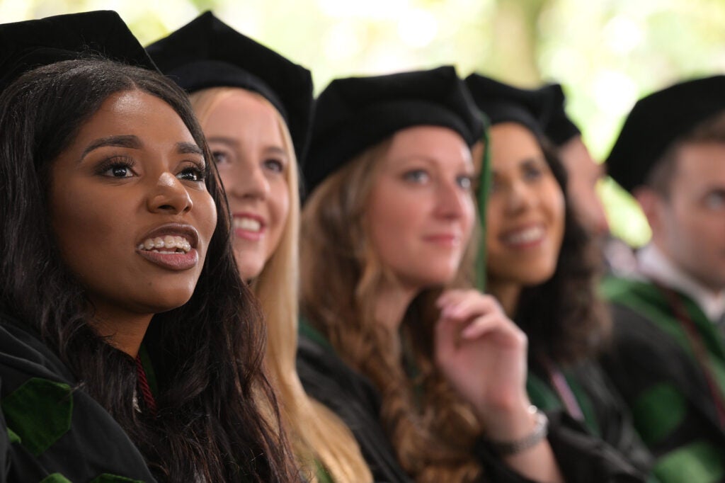 Students look up at the stage
