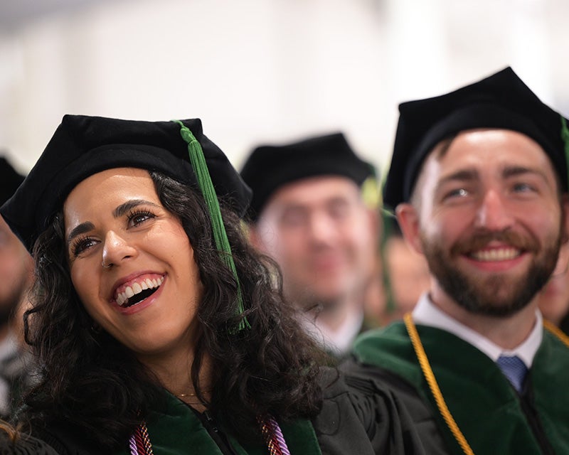 Students react to Dr. Gupta's speech with laughter