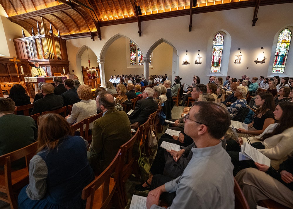 Dahlgren Chapel filled with those attending the Donor Mass over which Father Shea presides