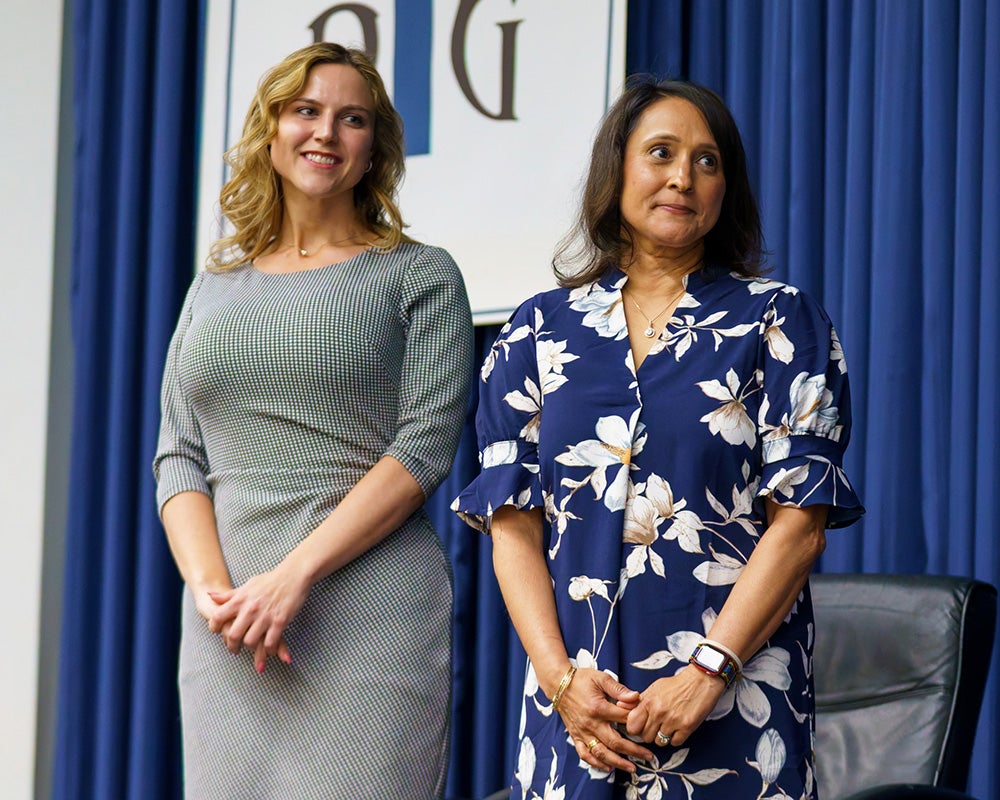 Caitlin Coker and Megha Fitzpatrick stand together