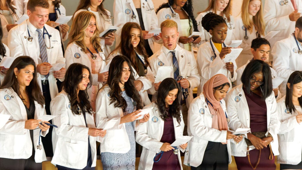 Medical students recite the Hippocratic Oath during their White Coat ceremony