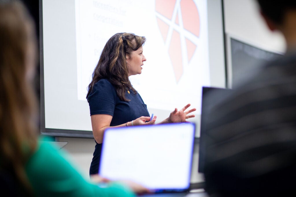 A woman presents to a class