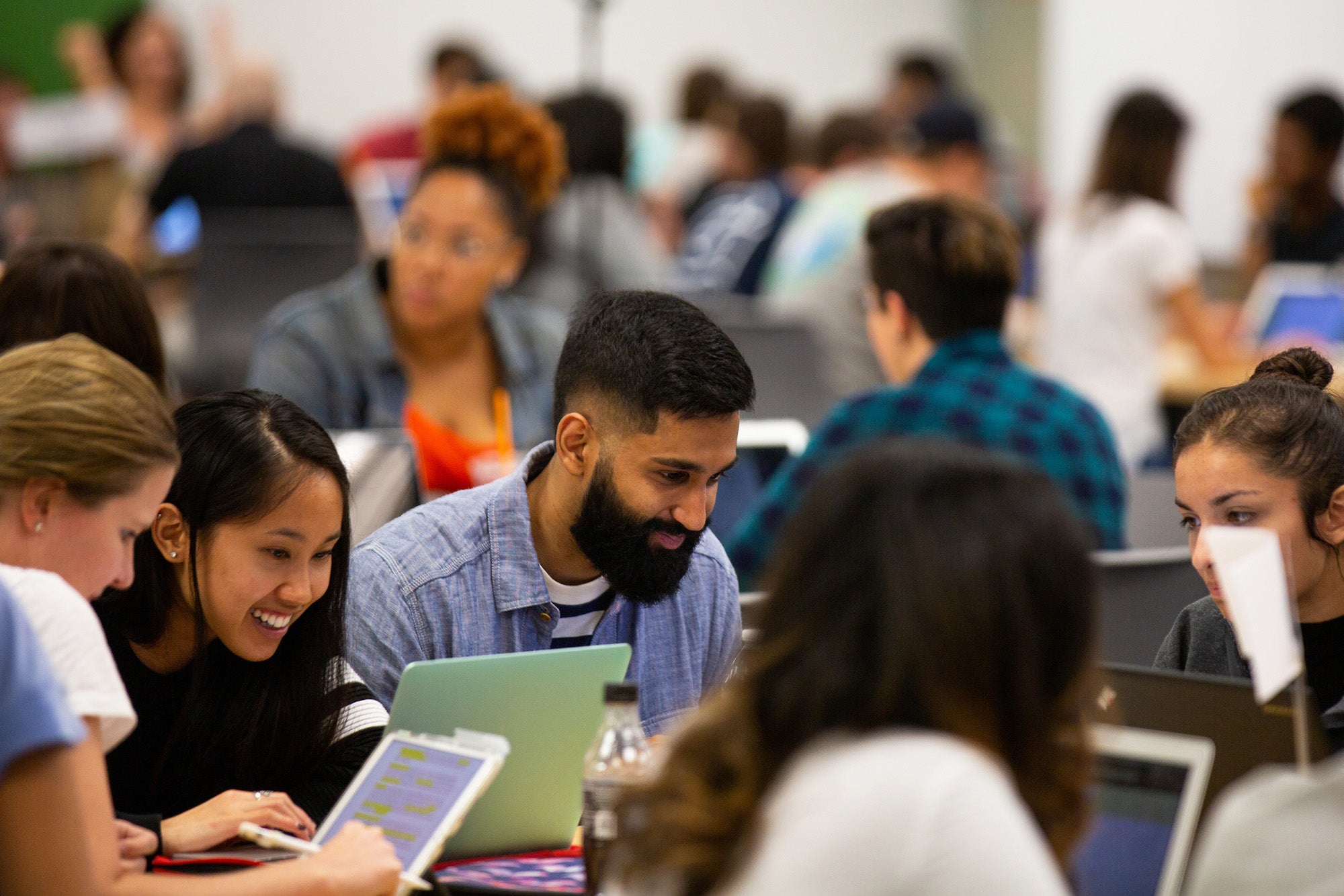 A group of students studies in DML