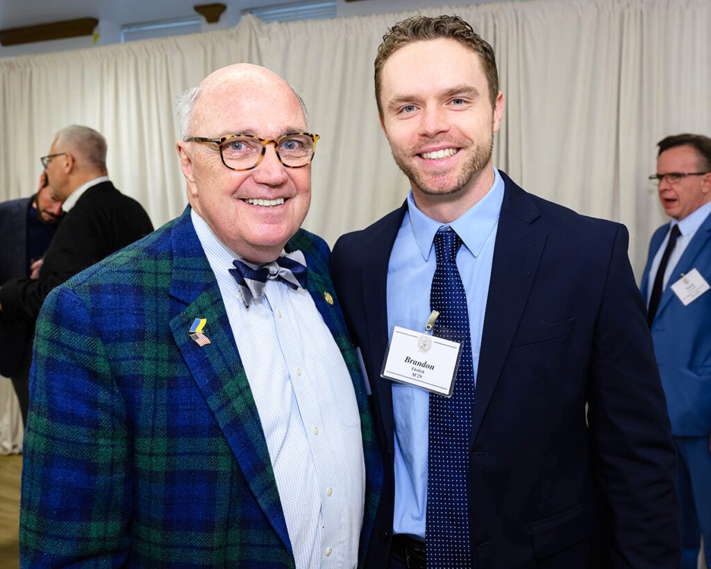 Dr. Mitchell and Brandon Ehrlich stand together at the annual Scholarship Brunch