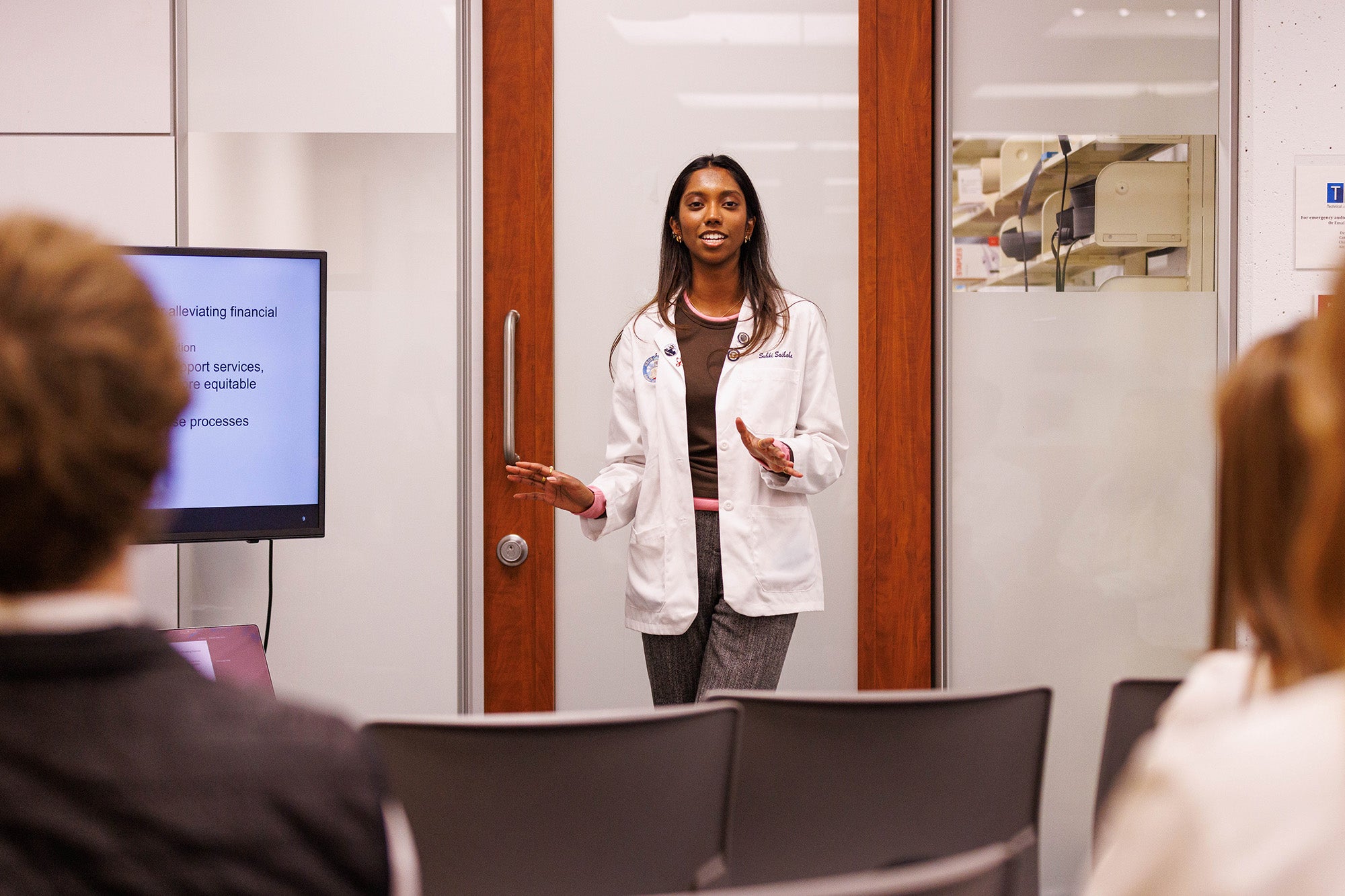 A medical student gives her presentation