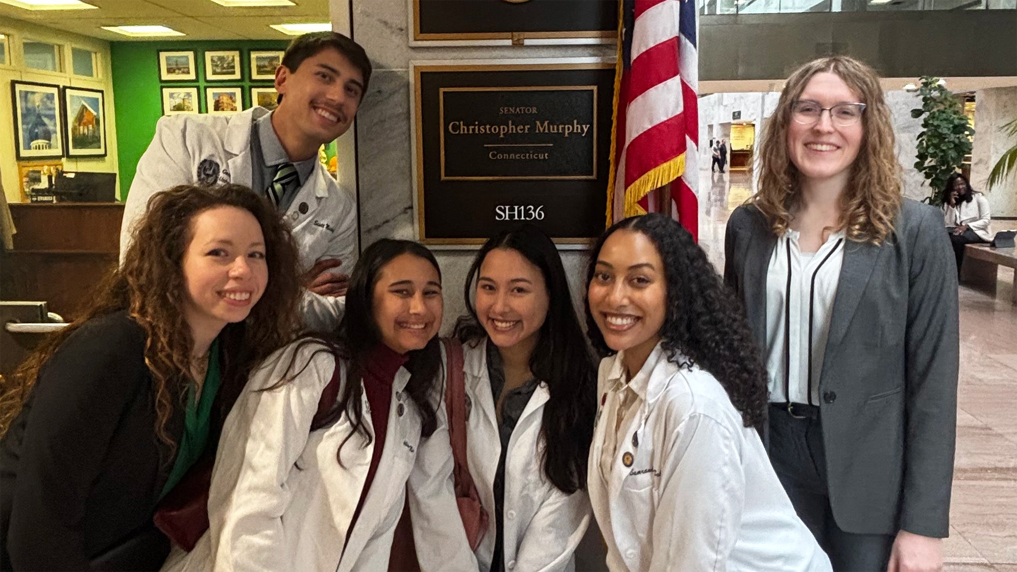 A group of Georgetown students stand together outside Sen. Christopher Murphy's office on Capitol Hill