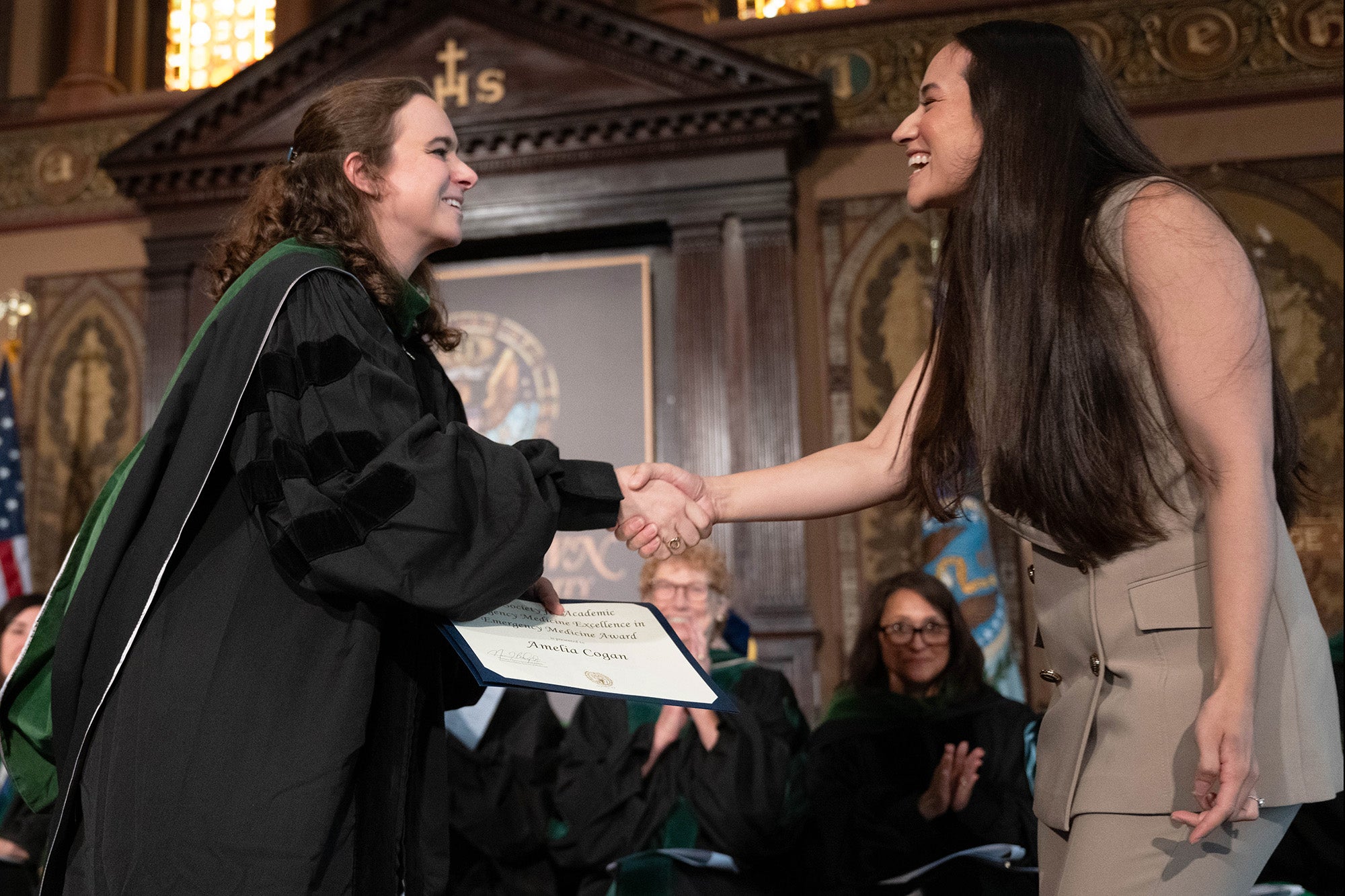 Dr. Alatis shakes hands with Amelia Cogan