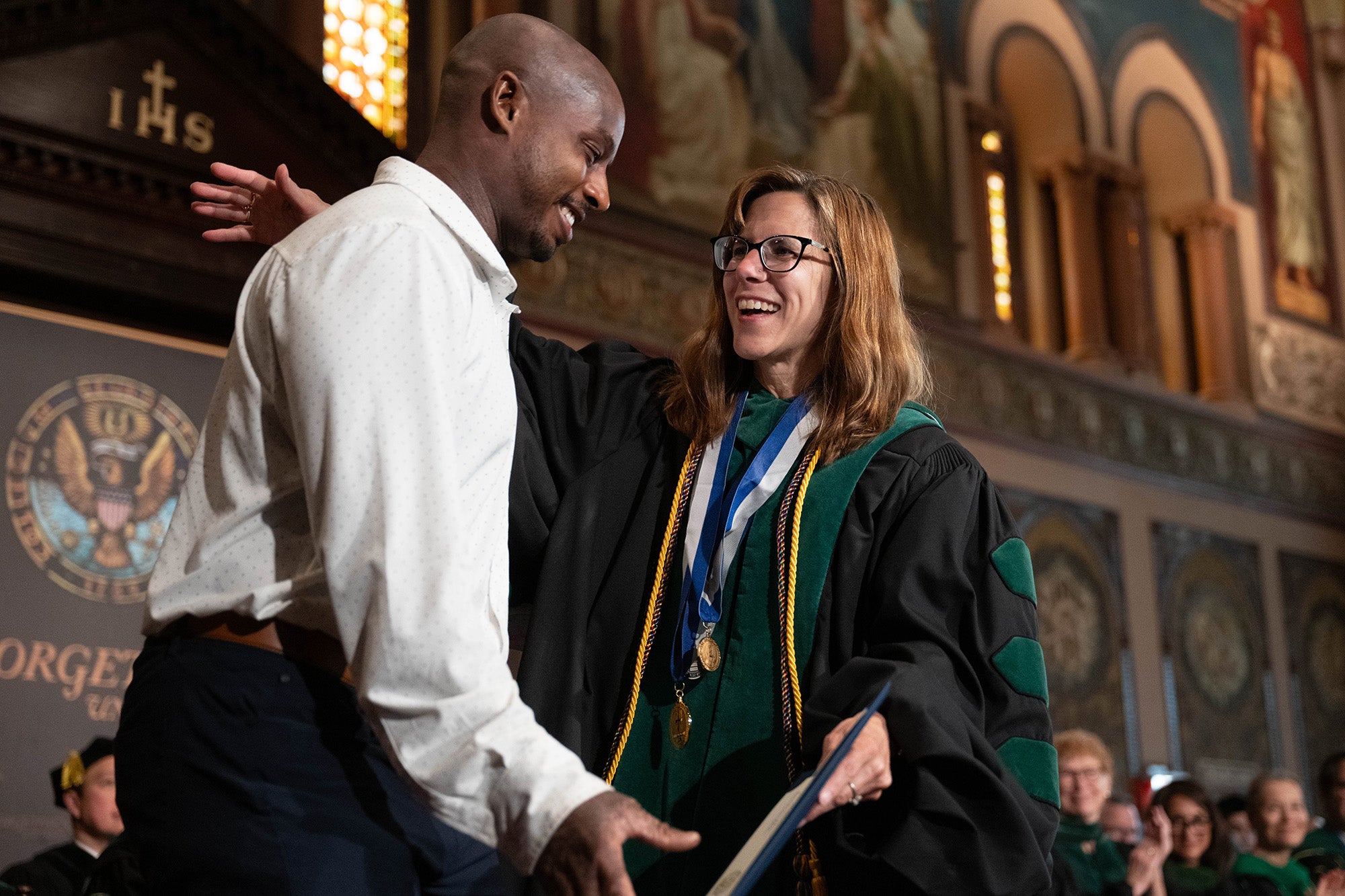 Mary Furlong gives Tyrel Powell a congratulatory hug