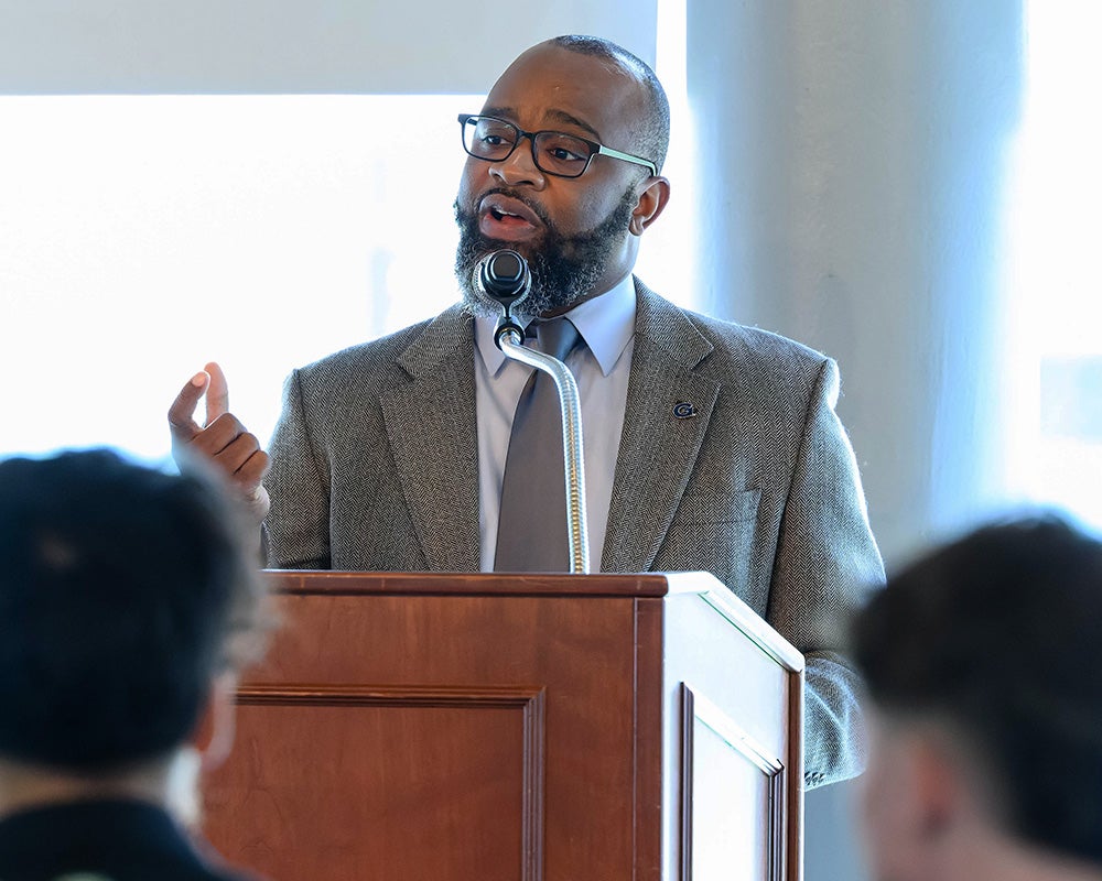 Khaseem Davis speaks at a podium