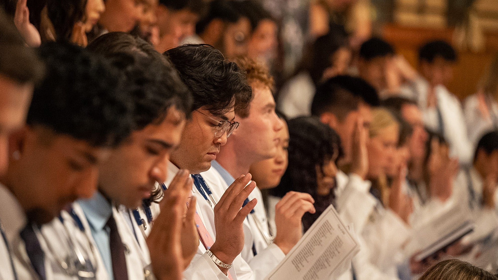 Students recite the Hippocratic Oath during the White Coat ceremony