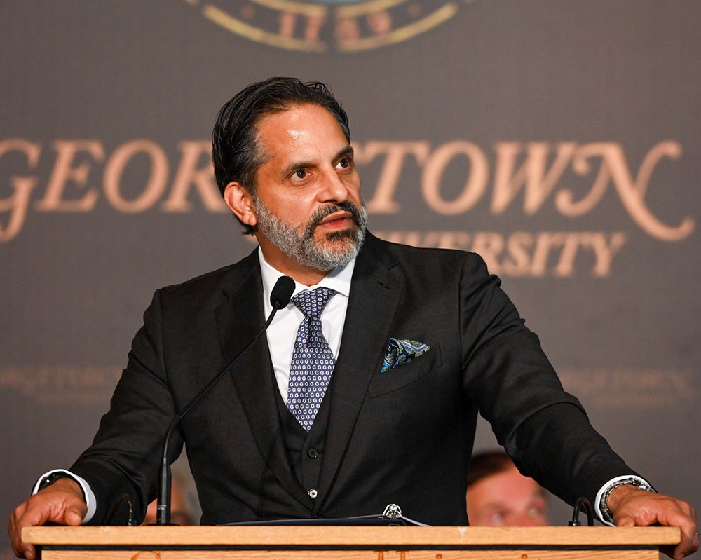 Eduardo Penalver speaks from a podium